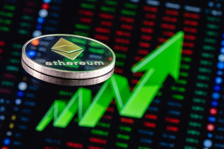 picture of an ethereum coin with an upward pointing green arrow with price charts behind it